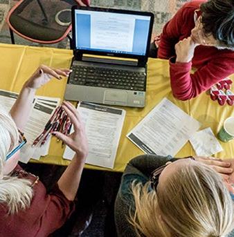 students-colaborating-at-large-table